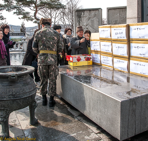 Korea's DMZ through my lens: Buddhist Monk blessing care packages of fruit and warm clothing at the DMZ Peace Temple