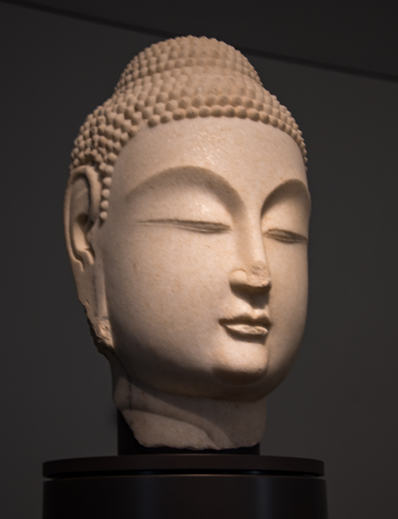 Louvre Abu Dhabi Breaks Boundaries Bridges Civilization: White marble Buddha head sculpted in the mid- 6th century is part of the exhibit of humanity