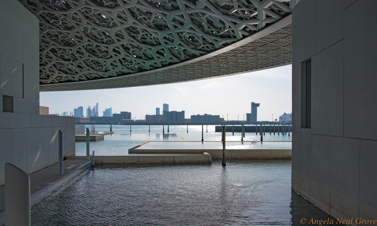 Louvre Abu Dhabi Breaks Boundaries Bridges Civilizations: View from the interior of the museum looking towards the skyline of the city