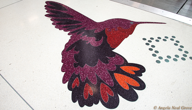 Hummingbird - one of the California motifs designed by Julie Chang for the floor of the Grand Hall. This vibrant hummer is at the base of the escalators. (Image: /A.N.Grove)