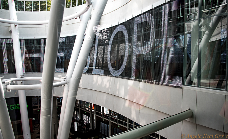 At the center of the Grand Hall of San Francisco's new Salesforce Transit Center is Jenny Holzer's LED scrolling art, "White Light", which reveals literature and history of the Bay Area. The installation wraps around the elliptical glass enclosure encircling the Grand Hall light column. (Image: / A.N. Grove)