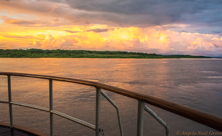 Amazon River Headwaters Adventure: Sunset view from the bow of the Delfin II exploration boat. Photo: ANGROVE