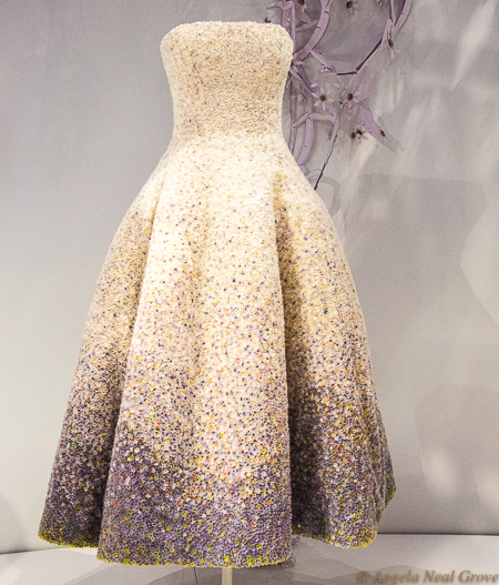 London Summer News and Views: Dior Exhibit at Victoria and Albert Museum: A dress is made in the style of a pointillist impressionist painting. It is a field of flowers. Tiny silk chiffon flower buds cover the dress, individually stitched on with silk threat in corresponding shades.  It
was worn by actor Natalie Portman, the face of Miss Dior perfume. Raf Simons, Haute Couture, 2012. Silk, organza, chiffon. //Photo: ANGrove