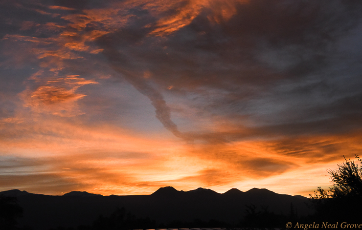 Otherworldly Atacama Desert. Stormy sunset over the chain of volcanoes along the Chile-Bolivia border. PHOTO: ANGROVE