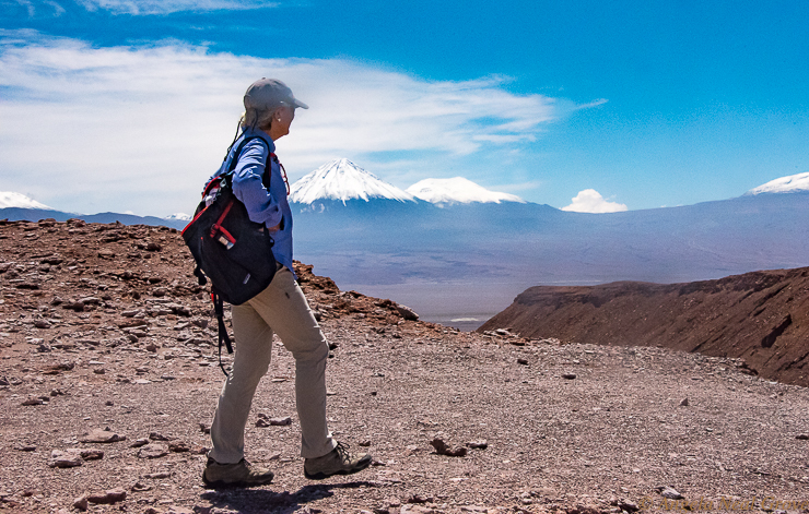 Otherworlding Atacama Desert.  Hiking along the rim above the Valley of the Moon where there are amazing views down into the valley with its strange luna rock formations and sandy dunes.  PHOTO ANGROVE