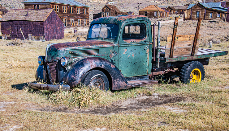 Is Bodie Ghost Town Haunted?   Old truck in the grass in Bodie. Bodie Ghost Town is a time capsule.PHOTO://ANGROVE