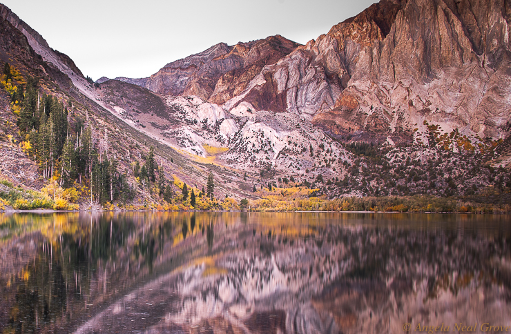 For the Berautyu of the Earth: Sunrise at Convict Lake, Mono County.  The rocks glow pink in the pre sunrise. Aspens in fall colors line the shore