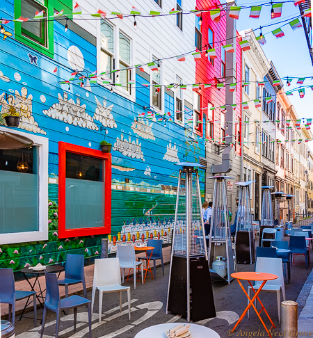 Small alleys have been converted and decorated with strings of lights and bunting to accommodate al fresco diners. Heat lamps keep everyone cozy when San Francisco's fog rolls in. PHOTO;//ANGROVE