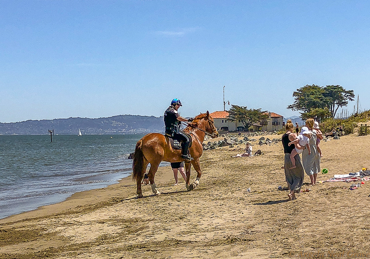 Park police ensuring mothers and children socially distance on the beach in San Francisco. Parking lots were closed. PHOTO;//ANGROVE