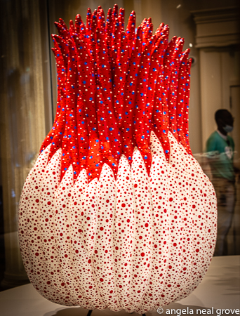 Enchanting Pumpkins: Flower Bud Opening to the Heavens, 2018. Created with sewn and stuffed fabric, acrylic paint and metal. This piece is shown in one of the interior galleries of the Gardens. Collection of the artist.  PHOTO: ANGROVE