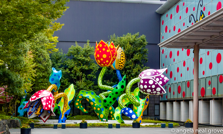 Enchanting Pumpkins: 
Masumoto City Museum, Japan, covered with Kusama's signature polka dots.  In the courtyard Kusama's tulips bob, twist and enchant visitors. Kusamas family lived and owned seed nurseries and land in Masumoto, a small town about 200 miles from Tokyo. PHOTO: ANGROVE