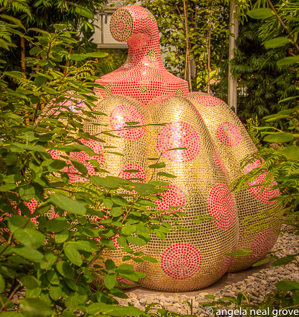 Enchanting Pumpkins: Starry Pumpkin,  2015 . Kusama fell in love with pumpkins when she was a child  and found one tangled in flowers and vines in her family's seed nursery. This one, partly hidden seems reminiscent of that discovery. PHOTO; ANGROVE