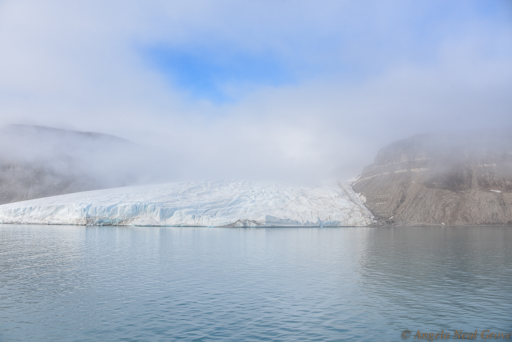 Northwest Passage Arctic Adventure:  One of the two glaciers in Croker Bay, Devon Island. This is a fjord on the south coast where we anchored after crossing Lancaster Sound in a swell and strong winds.  Here, the glaciers are retreating and they also actively calve, littering the bay with huge chunks of blue ice.
