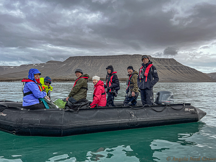 Northwest Passage Arctic Adventure: Exploring a fijord on Devon Island in a zodiac with our guide.  