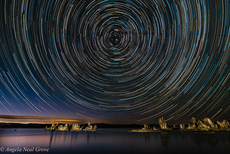 Star Trails - image of the stars as the earth revolves taken over a two hour time frame. In the foreground are Tufa Towers of Mono Lake California   Photo: ©ANGROVE