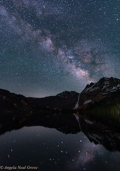 The Milky Way photographed over Silver Lake near Mammoth, California. There are star reflections in the water.
 Photo: ©ANGROVE