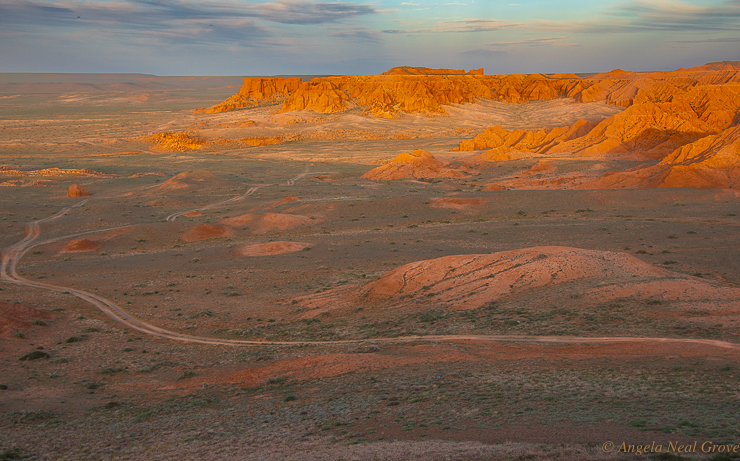 The Flaming Cliffs in Mongolia's Gobi desert glow a deep terracotta orange at sunset.  Dinosaurs were found here by an American team in 1920.  It is still the worlds richest dinosaur fossil area//Photo: ANGrove