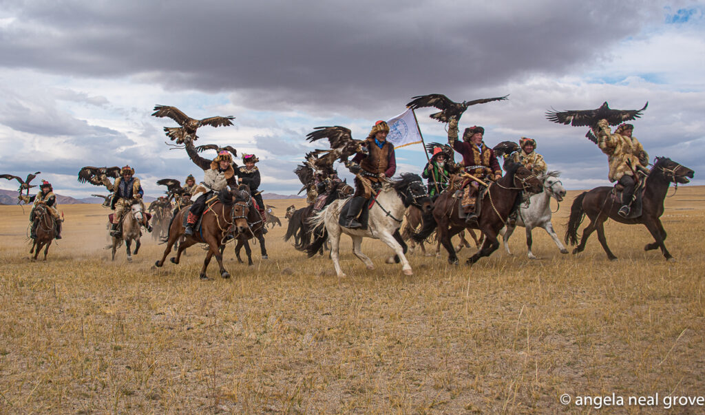 Parade of eagle hunters on their horses, with eagles, at the opening of the Kazakh Eagle Festival.Photo:// ANGrove