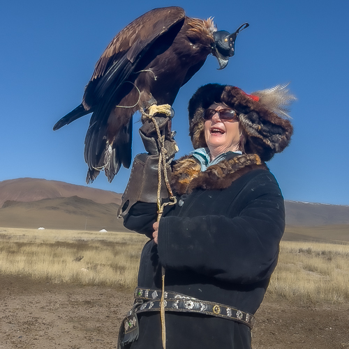 Here I am with traditional fur-lined coat and hat which is decorated with eagle feathers.  The bird was heavy, over 15 pounds, I could not hold her for long!
Photo:// ANGrove
