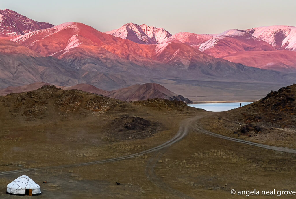 Setting sun turns the snowcapped mountains near our ger camp a soft pink.
Photo:// A.N Grove